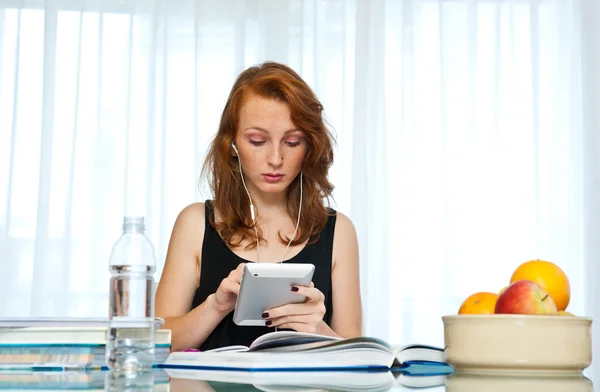 Attractive girl with freckles study at home — Stock Photo, Image