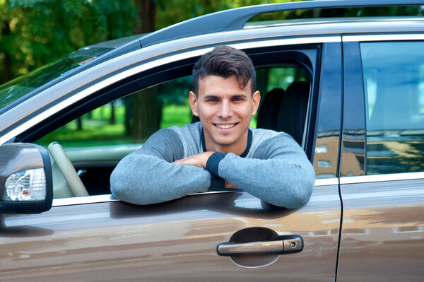 young man in his car