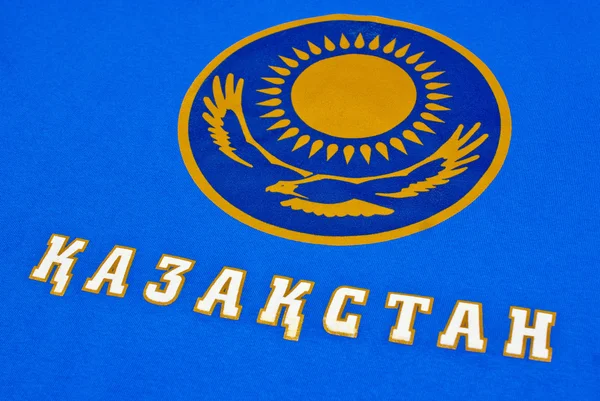 Kazakstan tecken på textil Stockbild