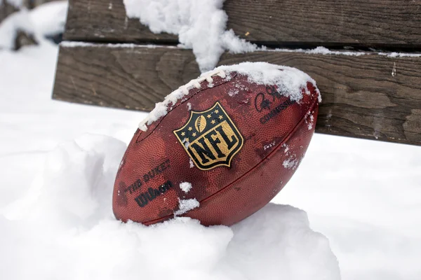 Official ball of NFL in the snow — Stock Photo, Image