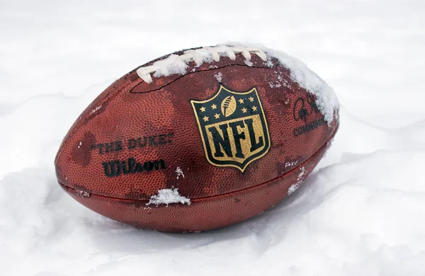 Official ball of NFL in the snow — Stock Photo, Image