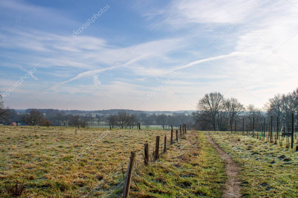 Walking trail in Dutch town of Markelo, Twente, at a frosty winter morning