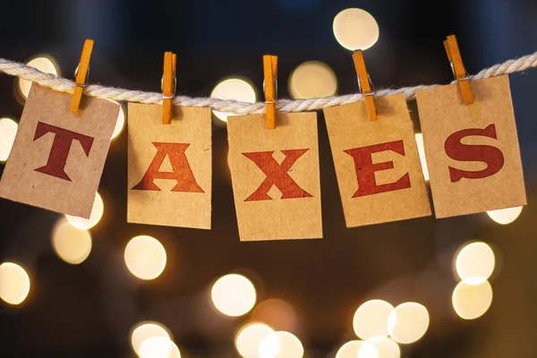 Taxes Concept Clipped Cards and Lights — Stock Photo, Image