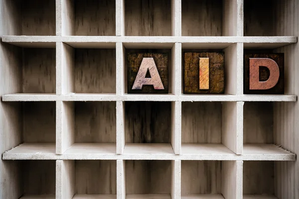 Aid Concept Wooden Letterpress Type in Draw — Φωτογραφία Αρχείου