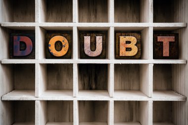 Doubt Concept Wooden Letterpress Type in Draw clipart
