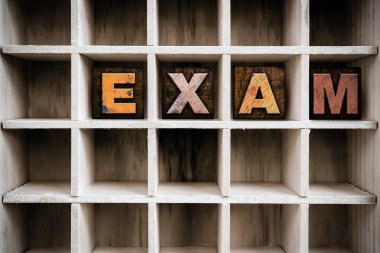 Exam Concept Wooden Letterpress Type in Draw