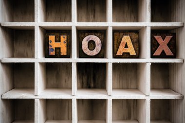 Hoax Concept Wooden Letterpress Type in Draw clipart