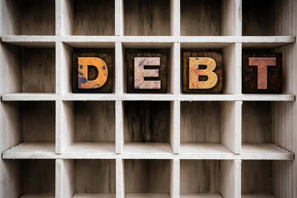 Debt Concept Wooden Letterpress Type in Draw — Stock Photo, Image