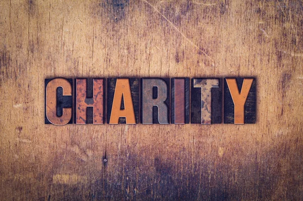 Charity-Konzept Buchdruck aus Holz — Stockfoto