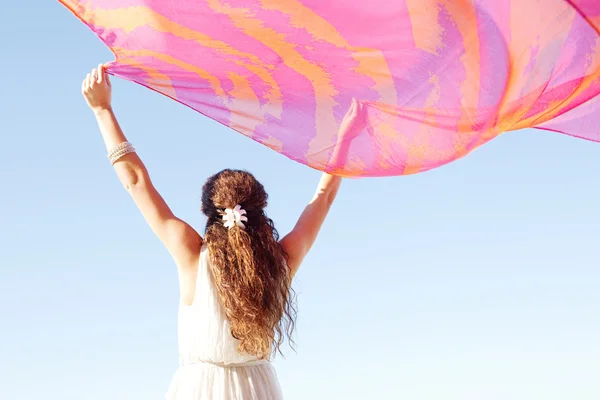 Woman holding a pink silk fabric — Stock Photo, Image