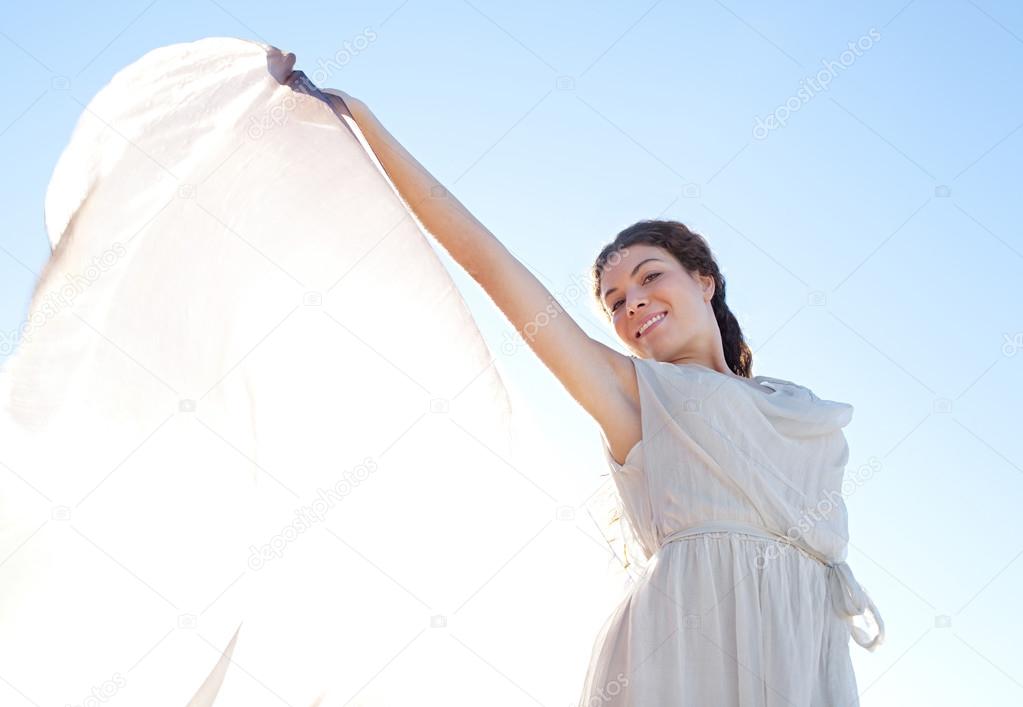 Elegant woman with  floating silk fabric