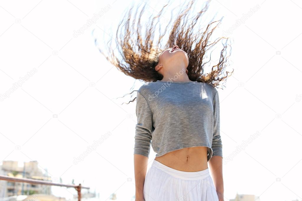woman flicking her hair up