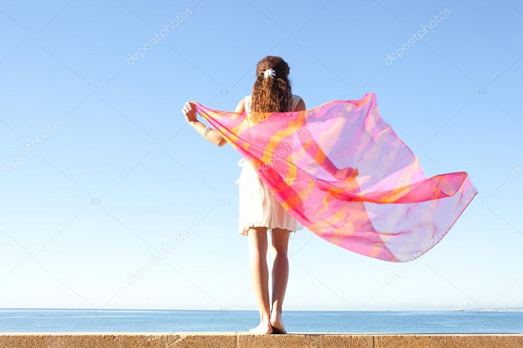 Elegant woman with  floating silk fabric