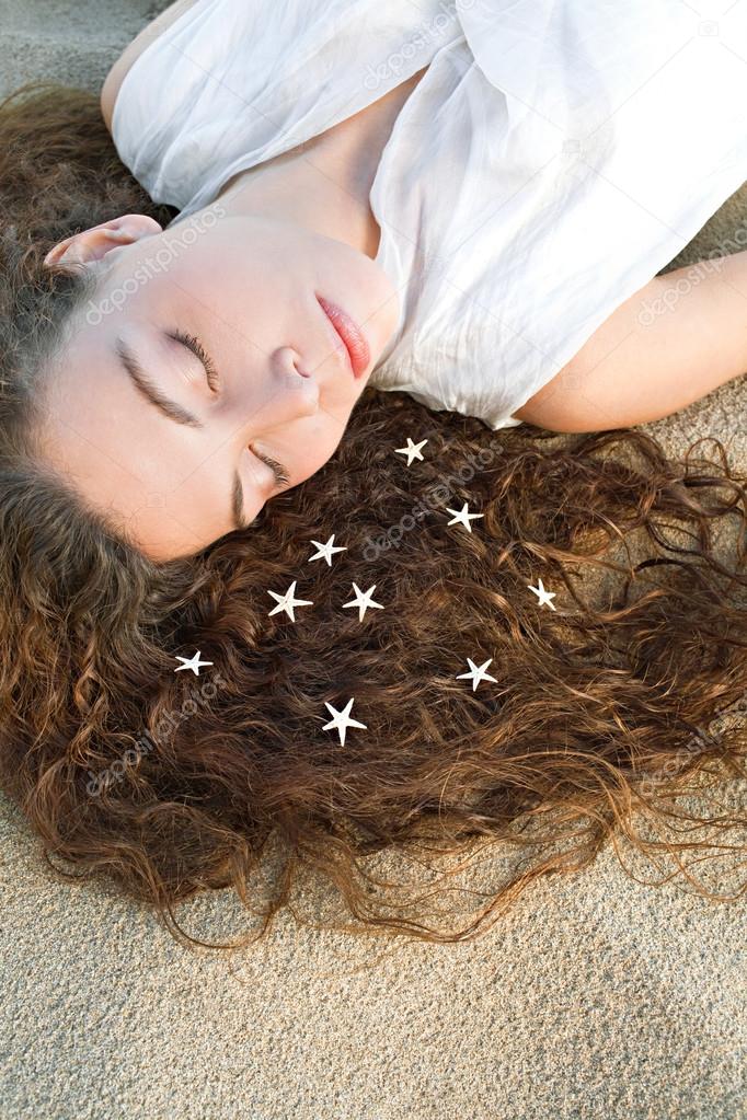 woman with star fish on  hair