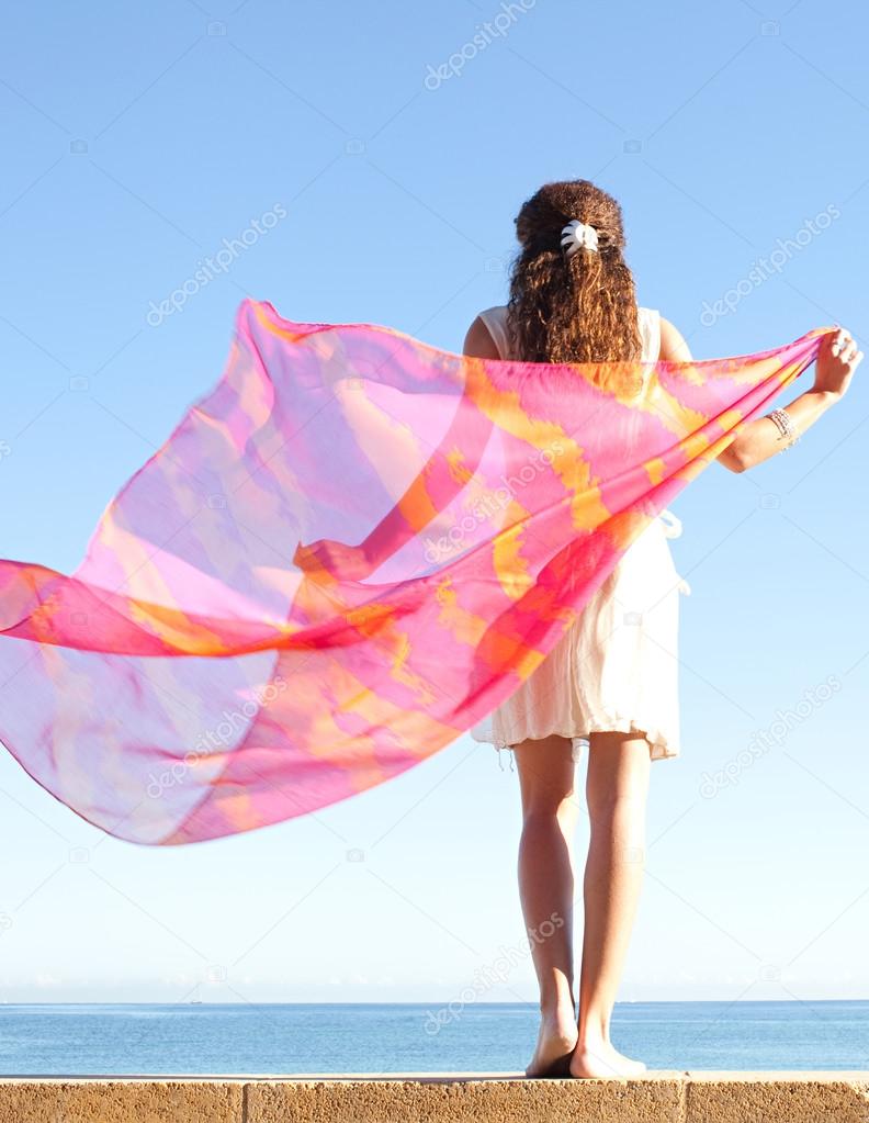 Elegant woman with  floating silk fabric