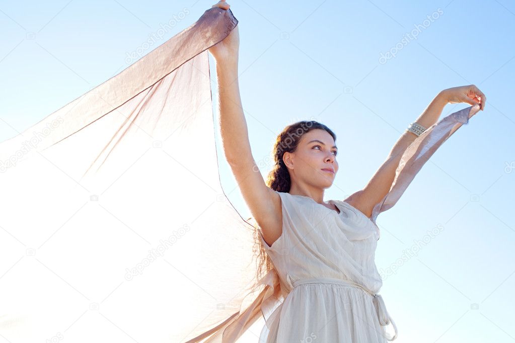 Elegant woman with  floating silk fabric