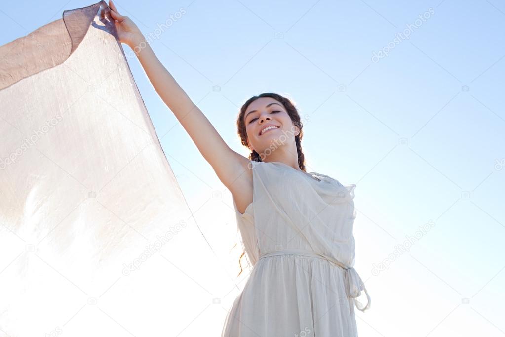 Elegant woman with  floating silk fabric