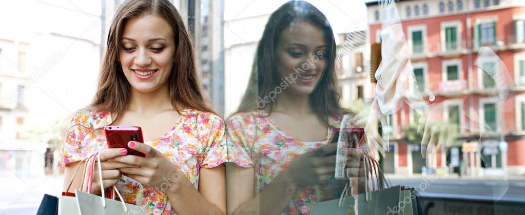 Attractive woman shopping with smartphone