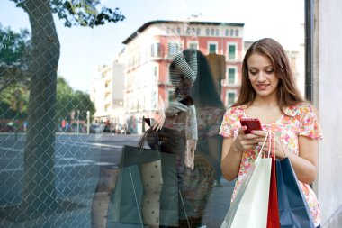 Attractive woman shopping with smartphone