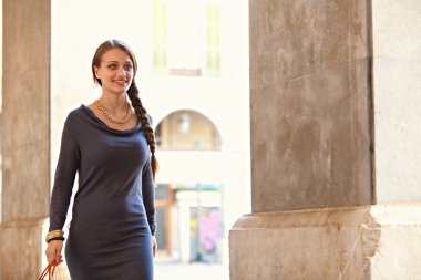 woman walking by stores