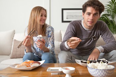 Couple eating Japanese sushi