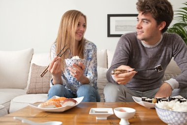 Couple eating Japanese sushi