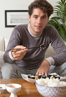 Man eating japanese sushi