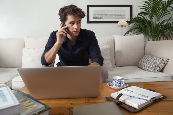 businessman with laptop working at home
