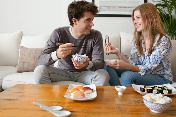 Couple eating Japanese sushi — стокове фото