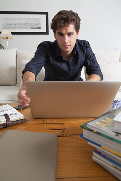 businessman with laptop working at home
