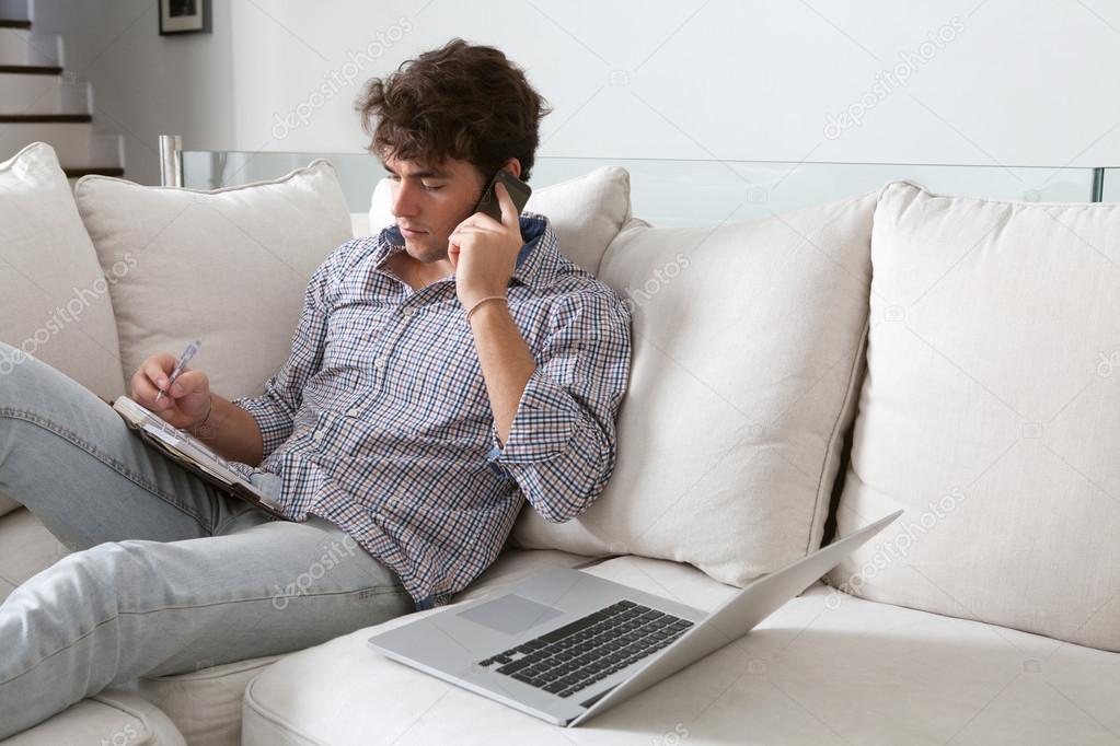 Businessman with laptop working at home