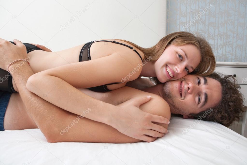Attractive young couple in bed