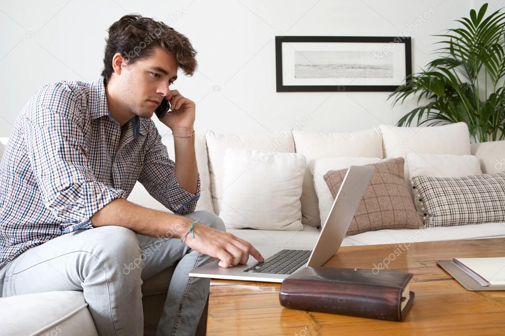 Businessman with laptop working at home