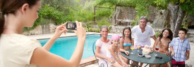 family posing for a photograph during a vacation together