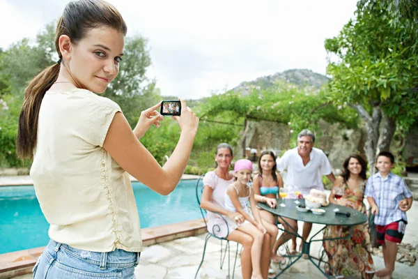 Family posing for a photograph during a vacation together — ストック写真