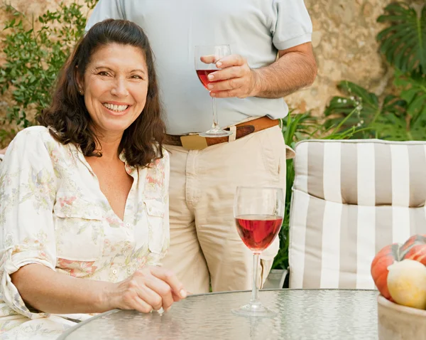 Couple drinking wine in the resort — Stock Photo, Image