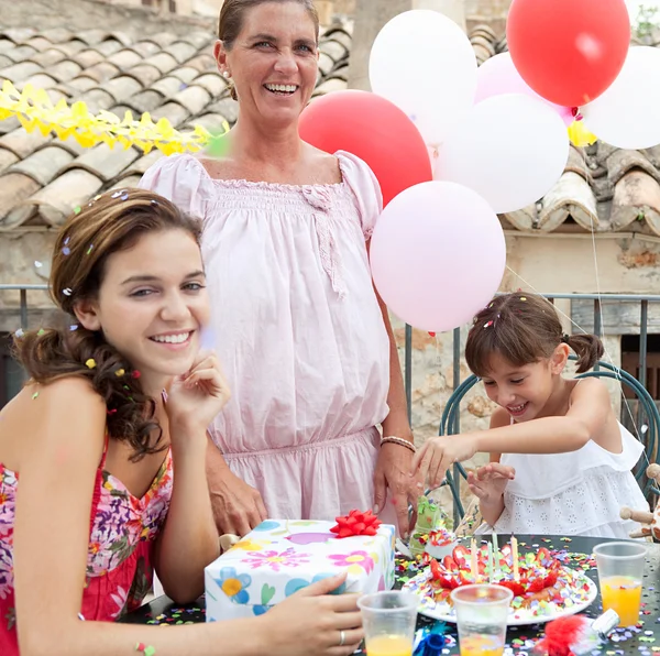 Family celebrating a girl child birthday — Stock Photo, Image