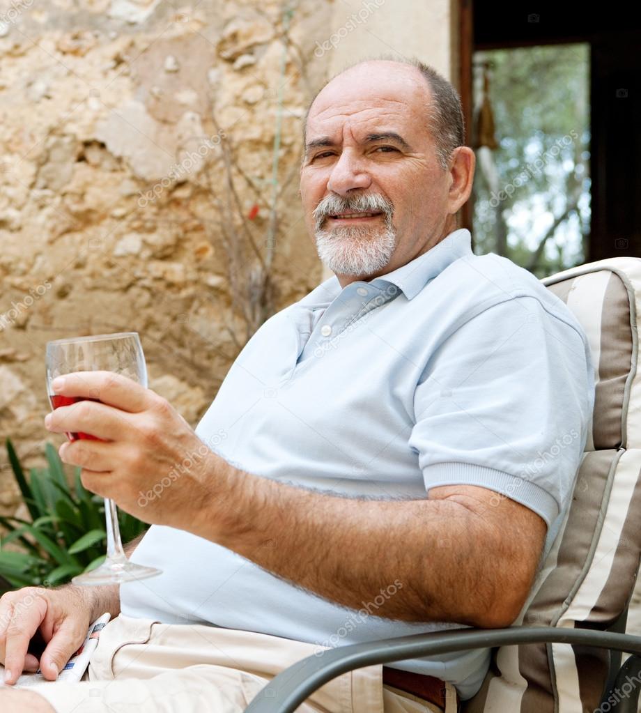 man drinking wine on vacation