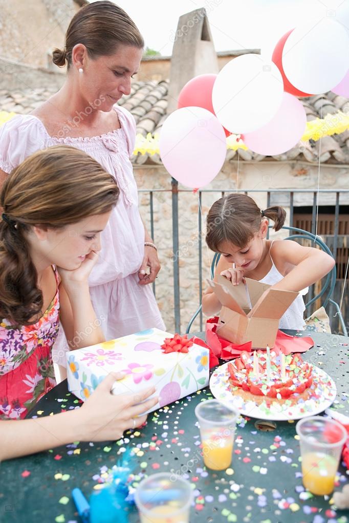 family celebrating a girl child birthday