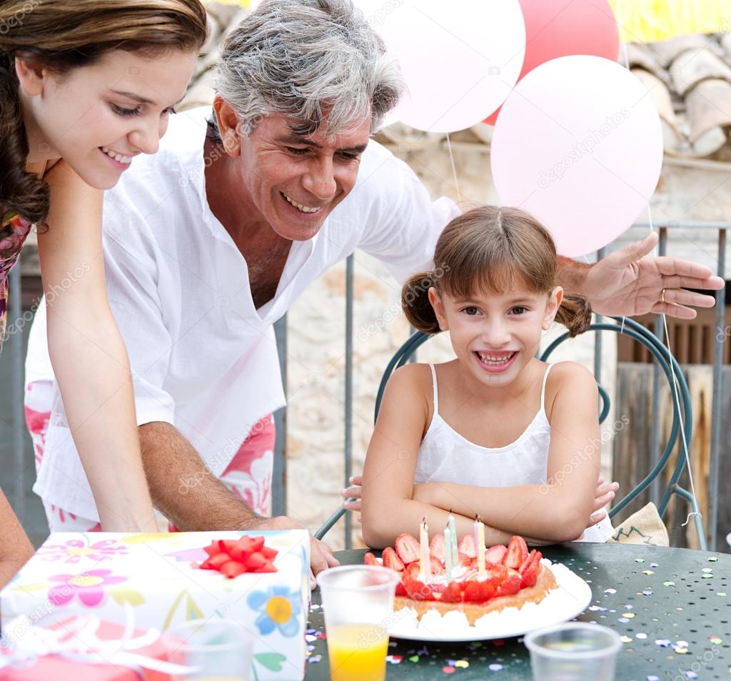 family celebrating a girl child birthday