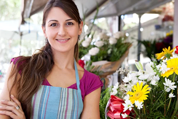 Florist woman in her store Royalty Free Stock Images