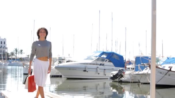 Woman walking on a small yachts port — Stock Video
