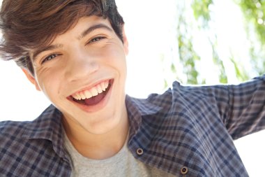 portrait of a teenager boy joyfully smiling clipart