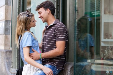 romantic couple embracing while shopping