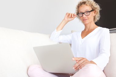 woman using a laptop computer and working clipart
