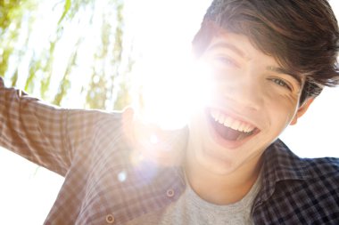 boy joyfully smiling expressing happiness