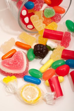 glass jar container with candy sweets and jelly beans