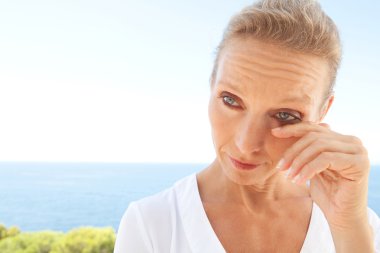 portrait of a woman looking worried and emotional