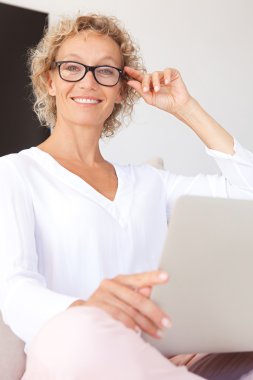 woman using a laptop computer and working