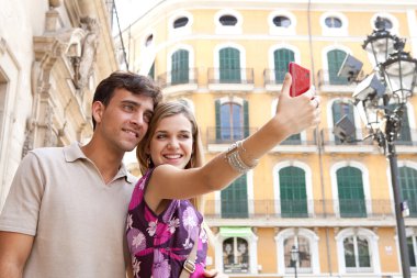 couple relaxing and taking a selfie picture of themselves